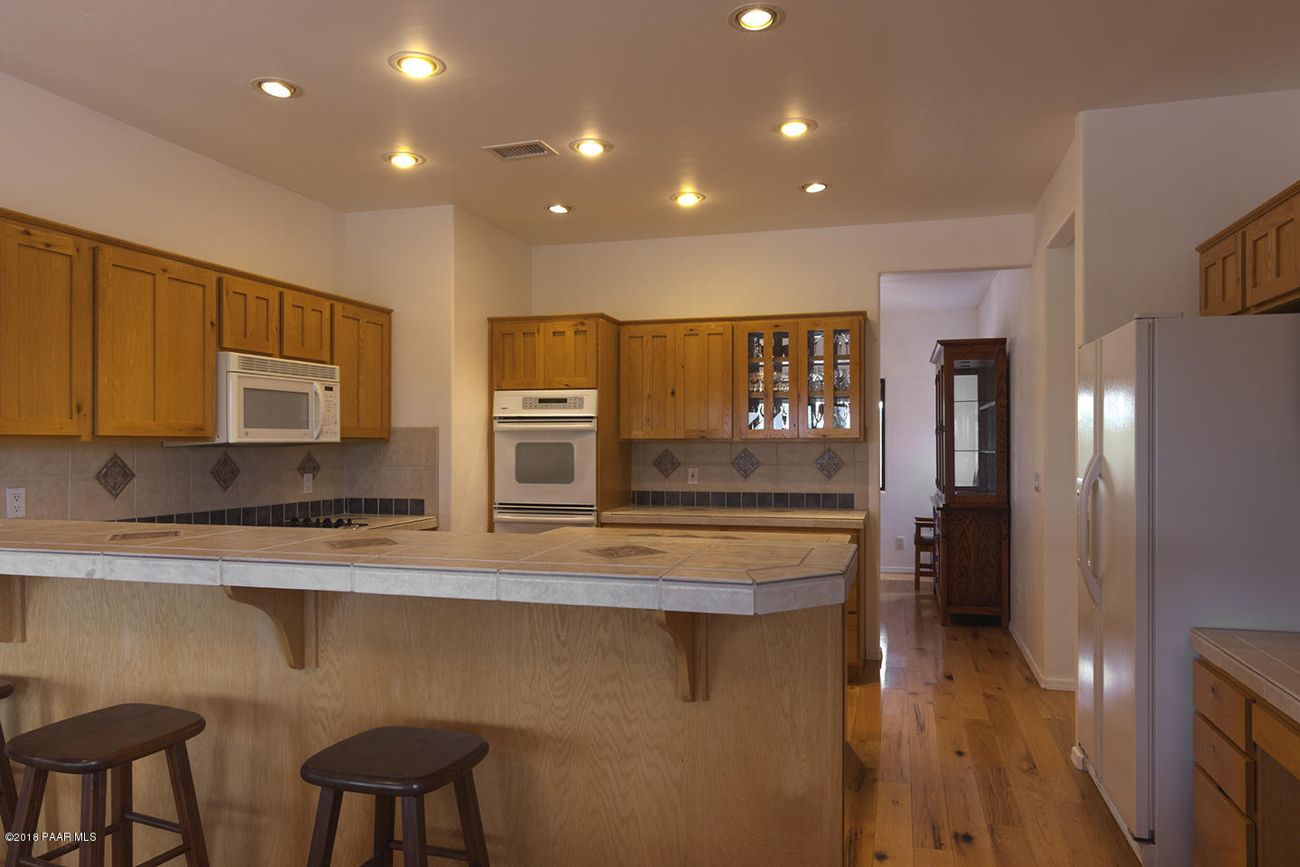 7600 Dillon Wash Road Prescott, AZ 86305 - Photo 13 of 35 a view of a kitchen with stainless steel appliances granite countertop a stove and a refrigerator