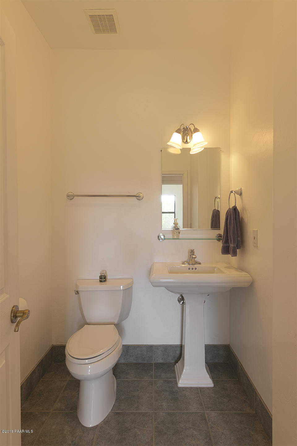 7600 Dillon Wash Road Prescott, AZ 86305 - Photo 16 of 35 a bathroom with a toilet a sink and mirror
