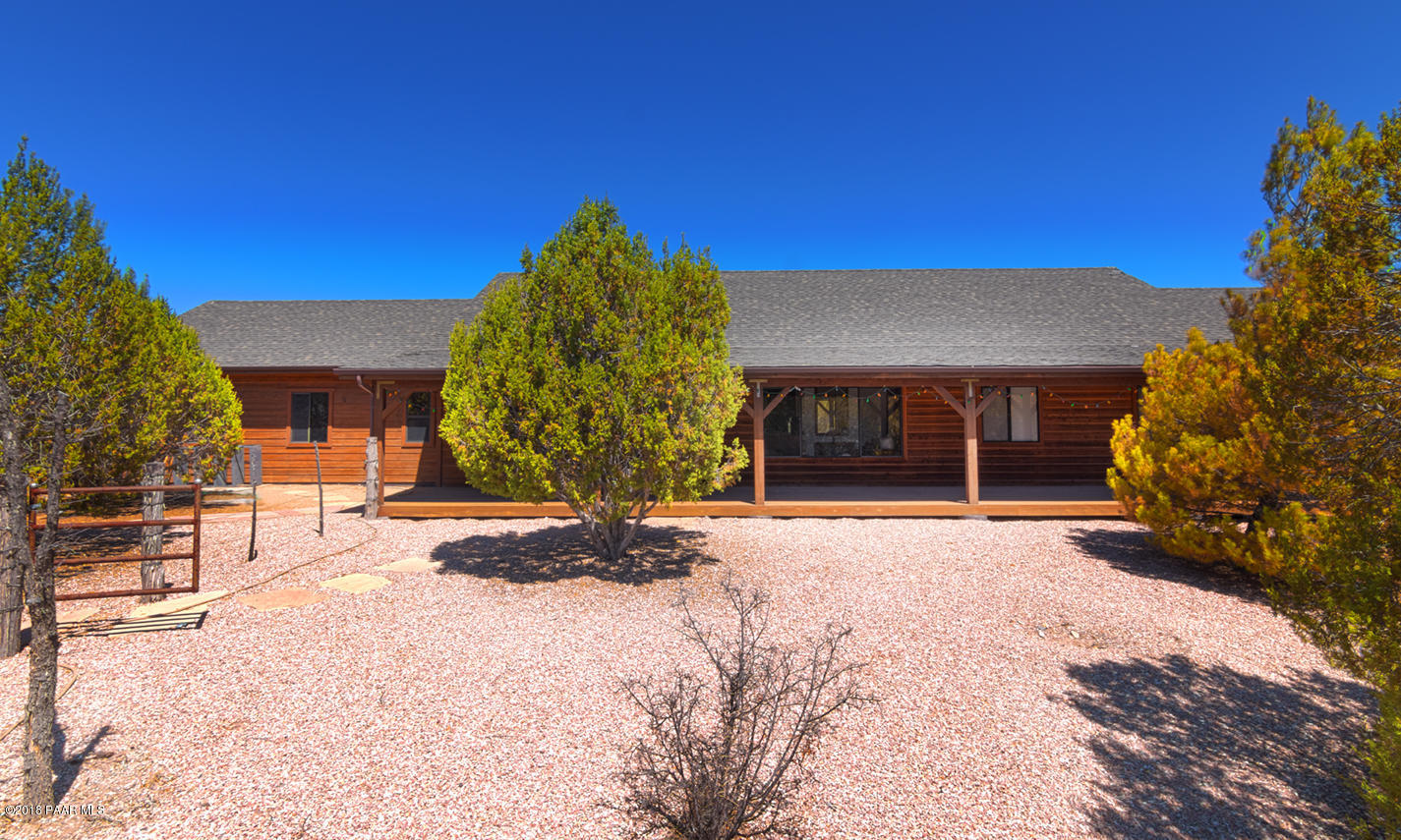 7600 Dillon Wash Road Prescott, AZ 86305 - Photo 2 of 35 a view of a house with a yard and garage