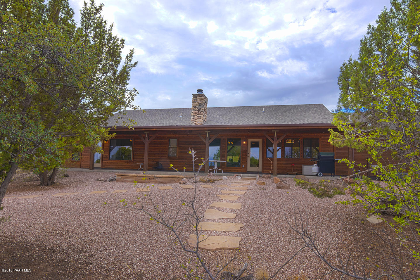 7600 Dillon Wash Road Prescott, AZ 86305 - Photo 26 of 35 a front view of a house with yard and parking