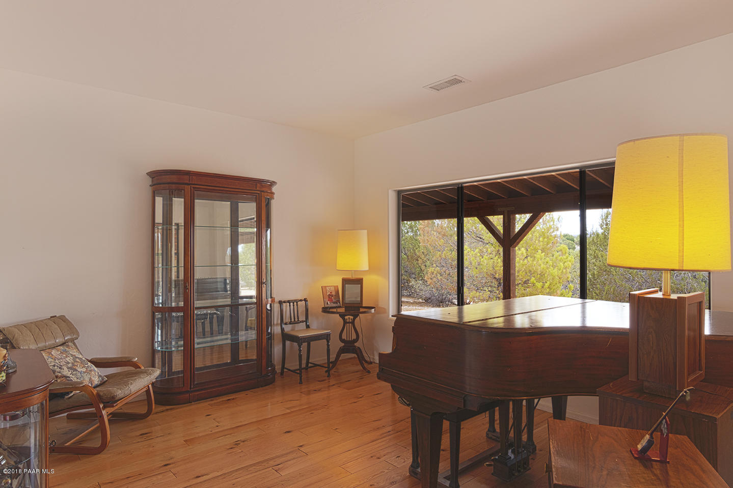 7600 Dillon Wash Road Prescott, AZ 86305 - Photo 9 of 35 a view of a dining room with furniture window and wooden floor