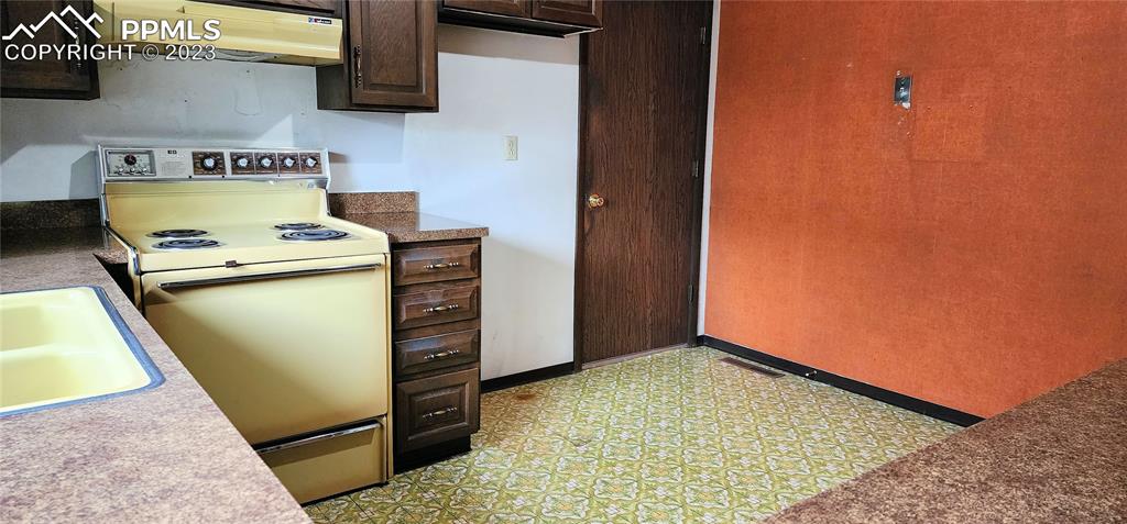 1404 Imperial Road Colorado Springs, CO 80918 - Photo 16 of 26 a kitchen with a stove and a refrigerator