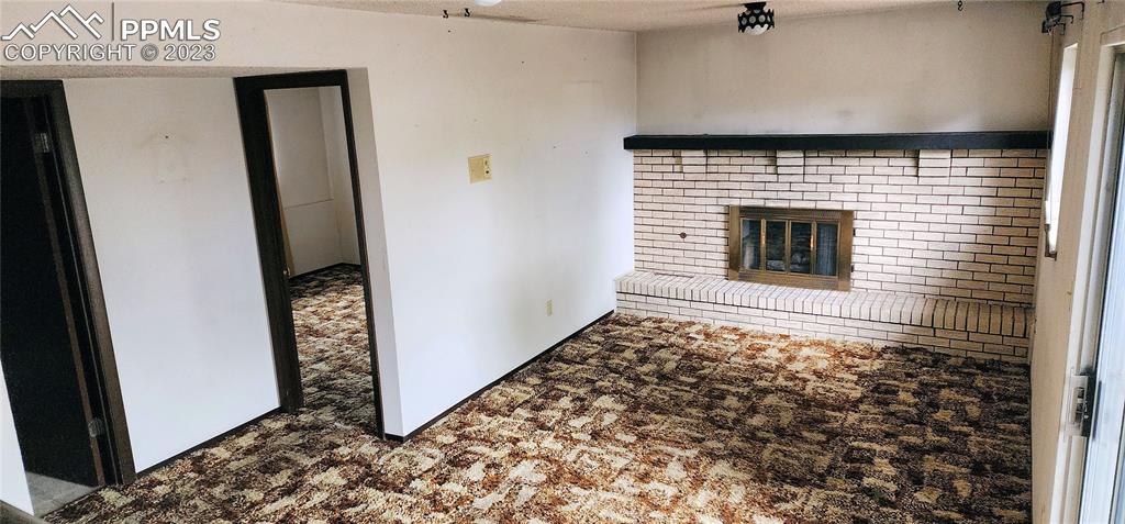 1404 Imperial Road Colorado Springs, CO 80918 - Photo 19 of 26 a room with window and a rug