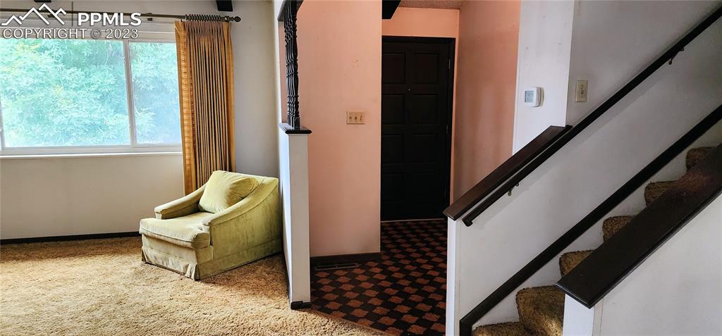 1404 Imperial Road Colorado Springs, CO 80918 - Photo 2 of 26 a living room with furniture and a large window