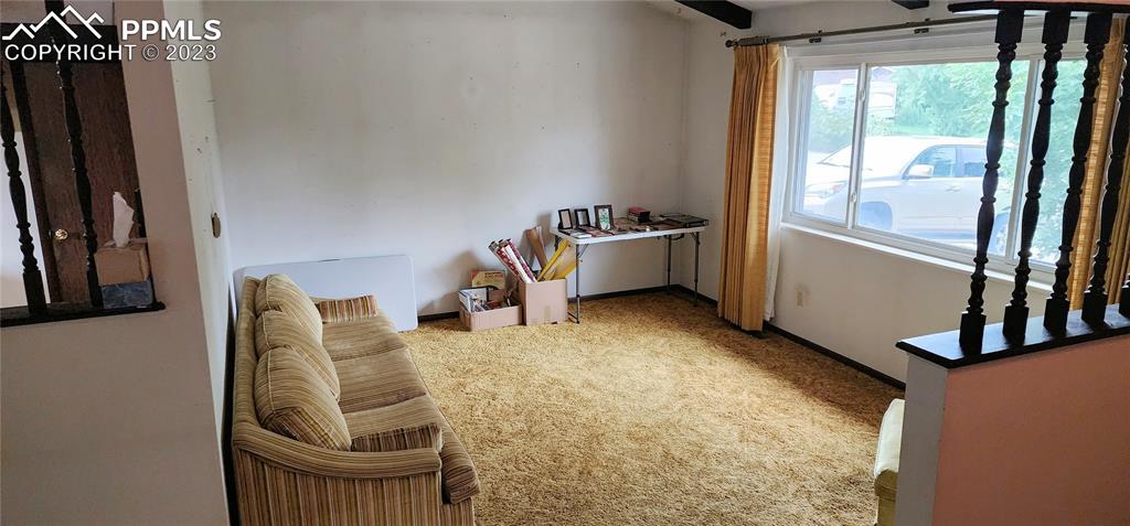 1404 Imperial Road Colorado Springs, CO 80918 - Photo 6 of 26 a view of a livingroom with furniture and windows