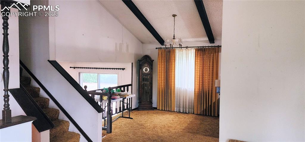 1404 Imperial Road Colorado Springs, CO 80918 - Photo 10 of 26 a view of an entryway with wooden floor and stairs