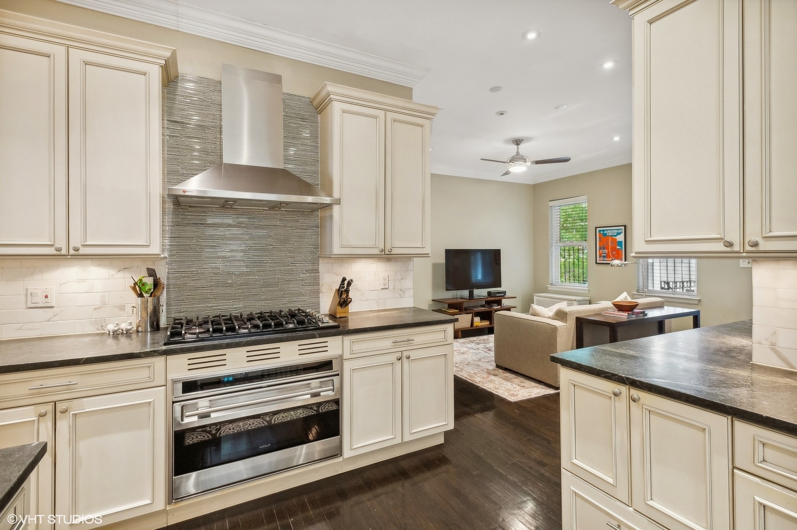 655 West Junior Terrace, Unit 1 Chicago, IL 60613 - Photo 11 of 24 a kitchen with stainless steel appliances granite countertop a stove and white cabinets