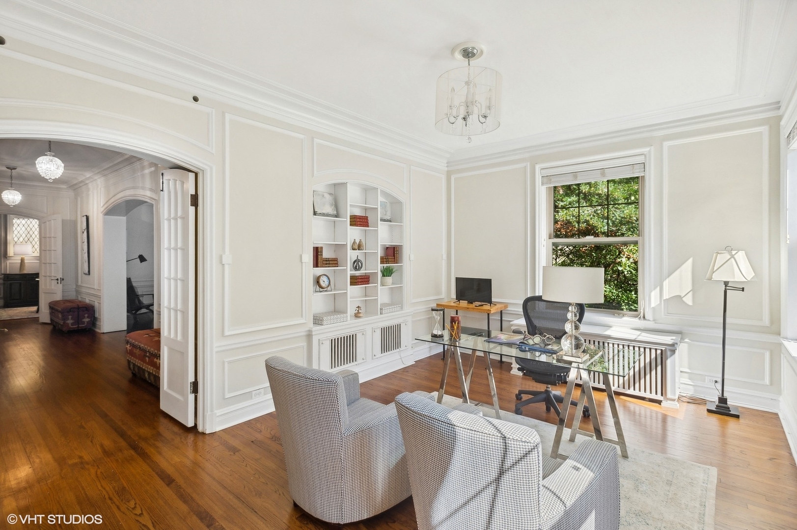 655 West Junior Terrace, Unit 1 Chicago, IL 60613 - Photo 15 of 24 a living room with furniture a large window and wooden floor
