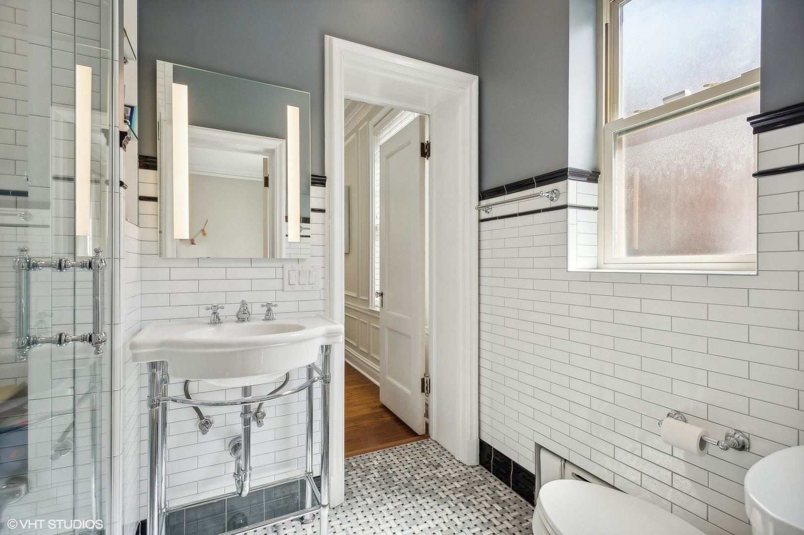 655 West Junior Terrace, Unit 1 Chicago, IL 60613 - Photo 18 of 24 a bathroom with a sink a toilet and shower