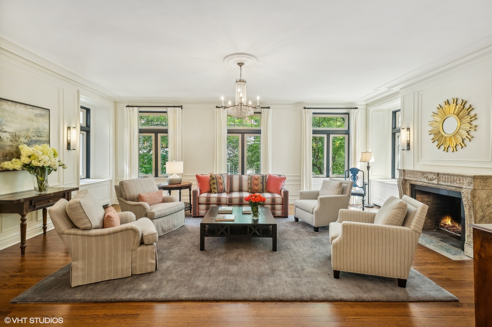655 West Junior Terrace, Unit 1 Chicago, IL 60613 - Photo 2 of 24 a living room with furniture fireplace and a large window