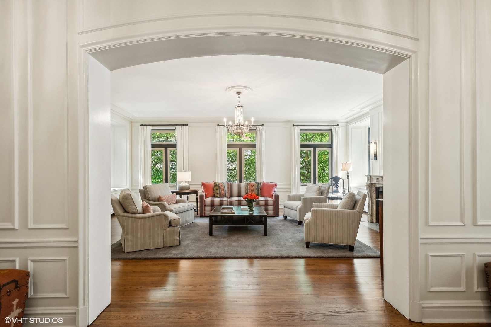 655 West Junior Terrace, Unit 1 Chicago, IL 60613 - Photo 3 of 24 a living room with fireplace furniture and a large window