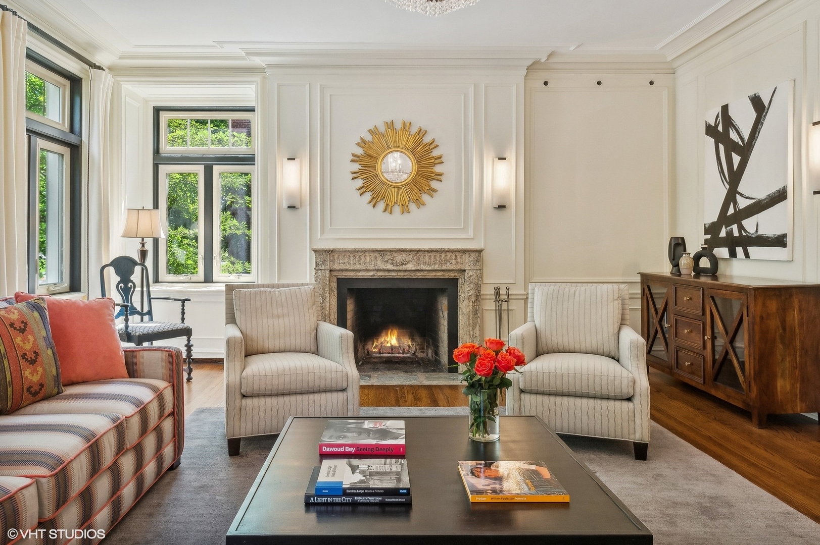 655 West Junior Terrace, Unit 1 Chicago, IL 60613 - Photo 4 of 24 a living room with furniture a flat screen tv and a fireplace