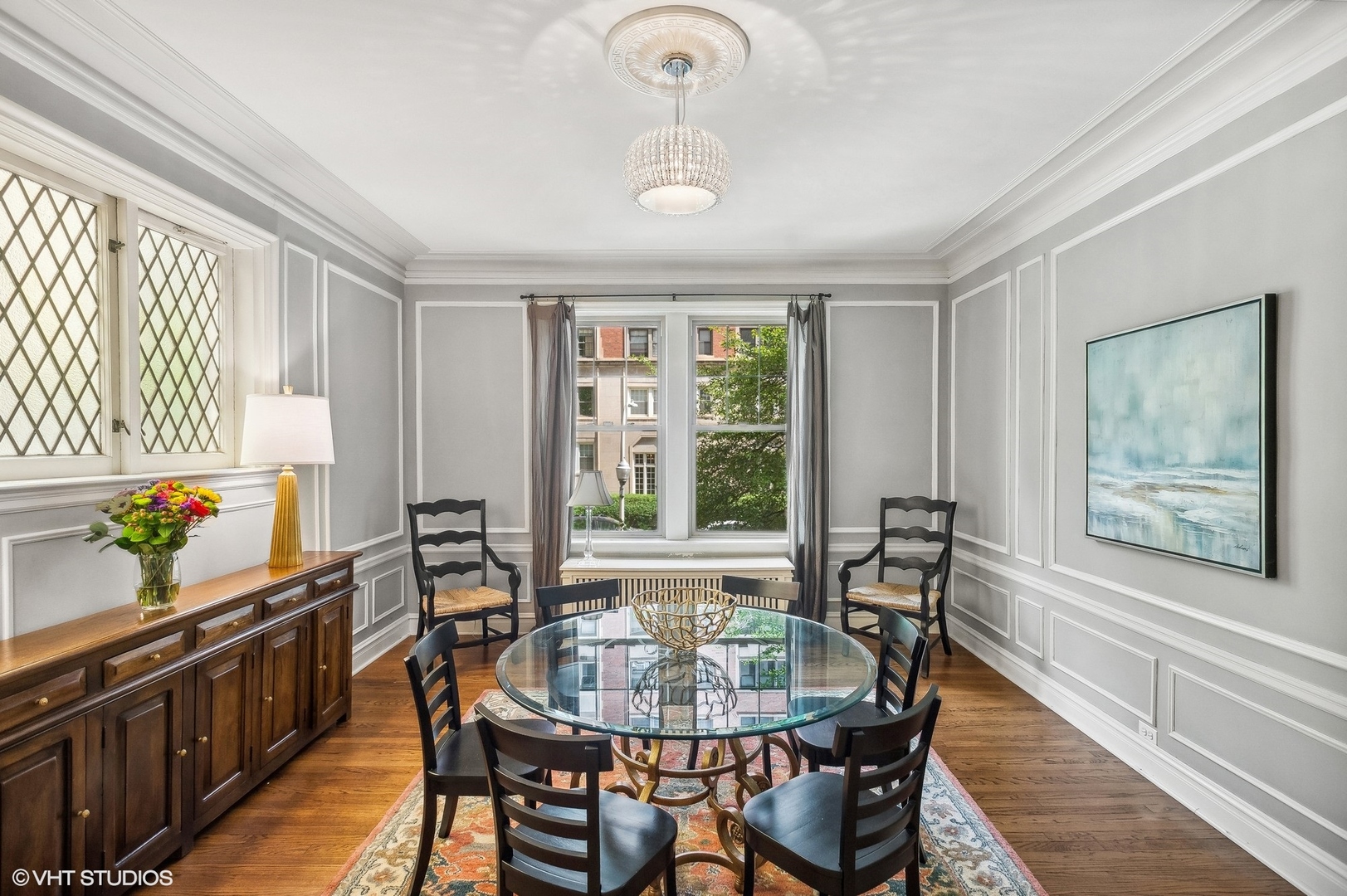 655 West Junior Terrace, Unit 1 Chicago, IL 60613 - Photo 7 of 24 a dining room with furniture and window
