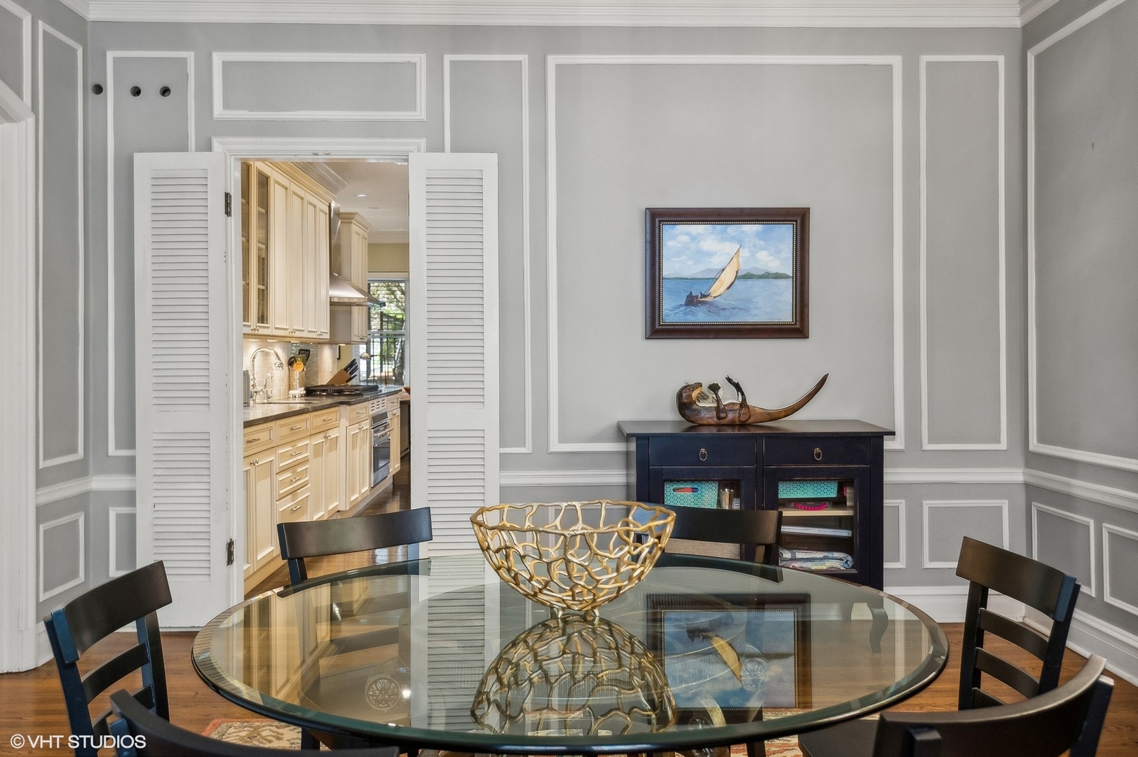 655 West Junior Terrace, Unit 1 Chicago, IL 60613 - Photo 8 of 24 a view of a dining room with furniture a chandelier and wooden floor