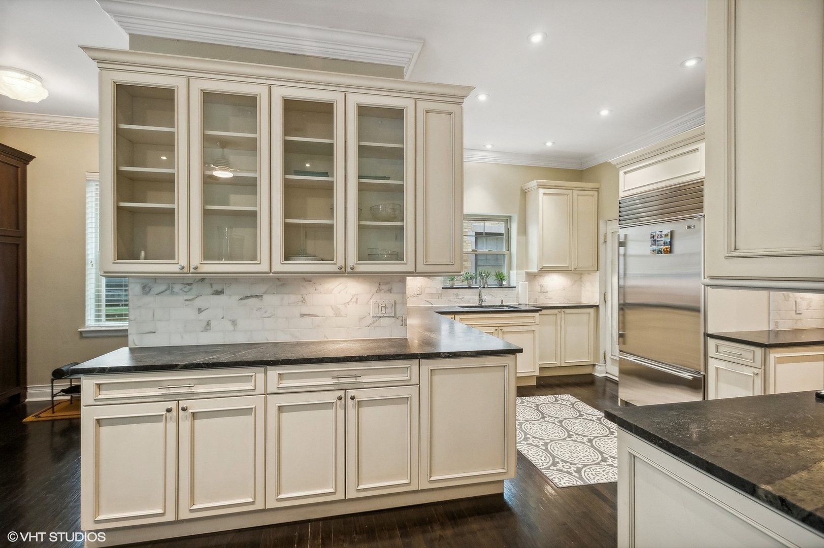 655 West Junior Terrace, Unit 1 Chicago, IL 60613 - Photo 9 of 24 a kitchen with granite countertop a sink and cabinets