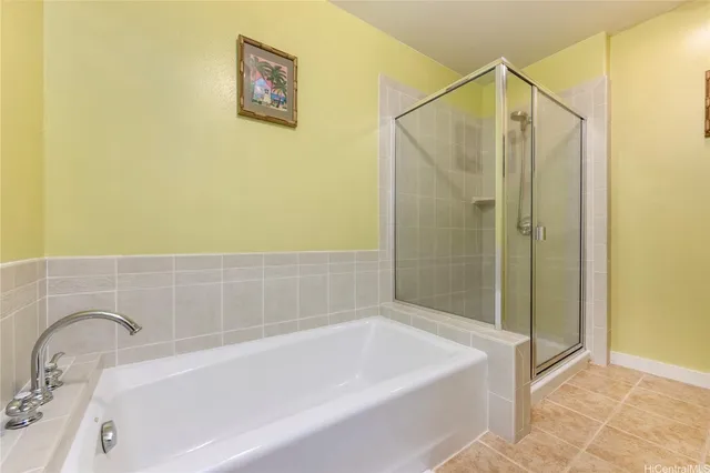 a bathroom with a bathtub and shower