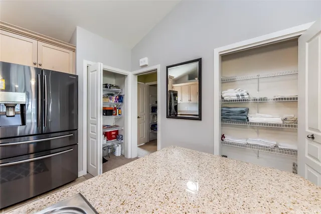 a kitchen with a refrigerator and a sink