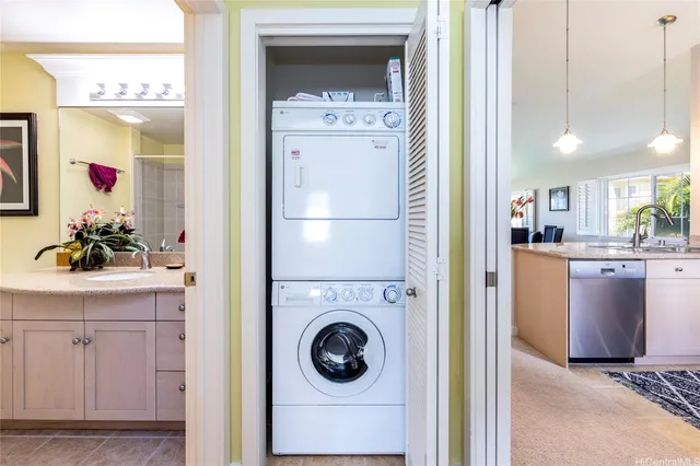 a view of a hallway with washer and dryer