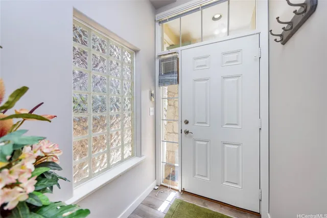a view of entryway with wooden floor