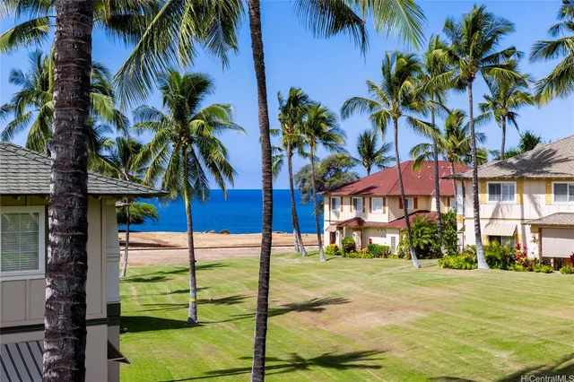 a view of a palm trees in front of a building