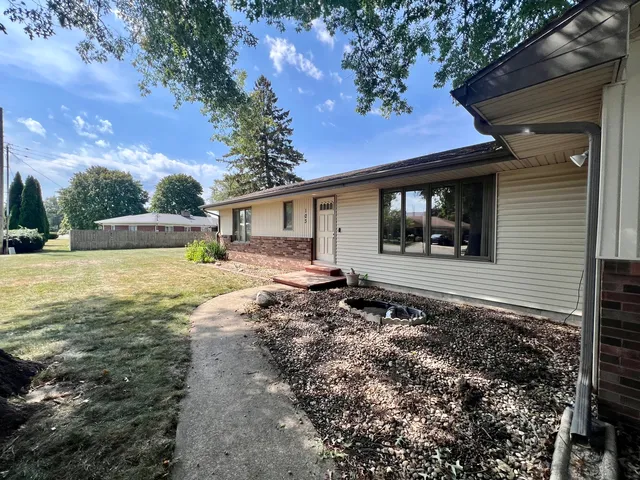 a front view of a house with yard