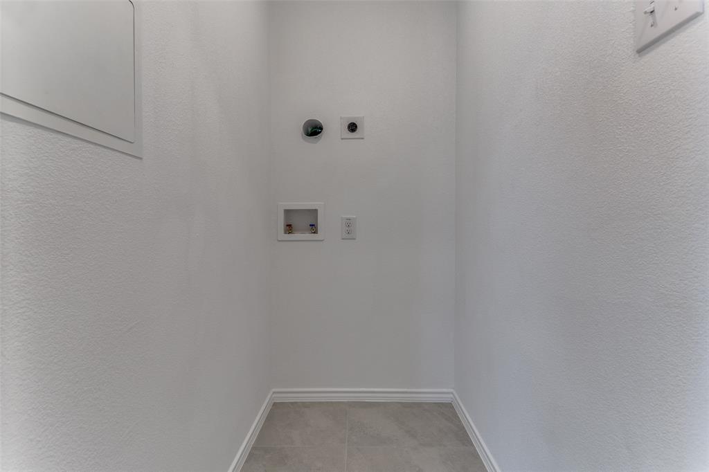 127 Sunflower Street Princeton, TX 75407 - Photo 14 of 21 Washroom featuring hookup for an electric dryer, tile floors, and washer hookup