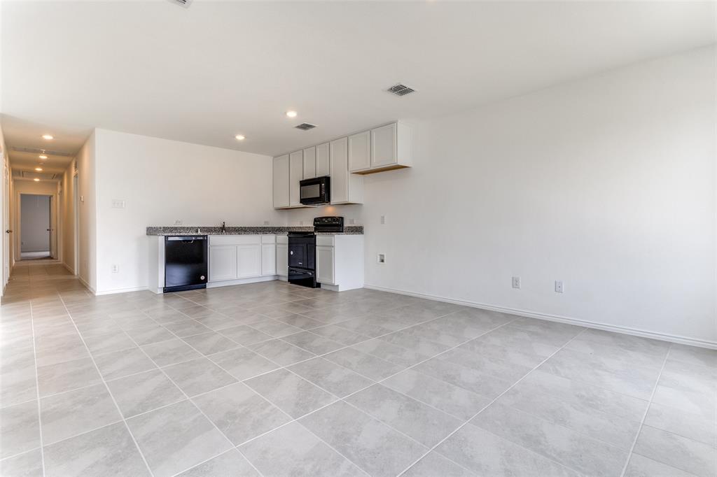 127 Sunflower Street Princeton, TX 75407 - Photo 2 of 21 Unfurnished living room with light tile floors