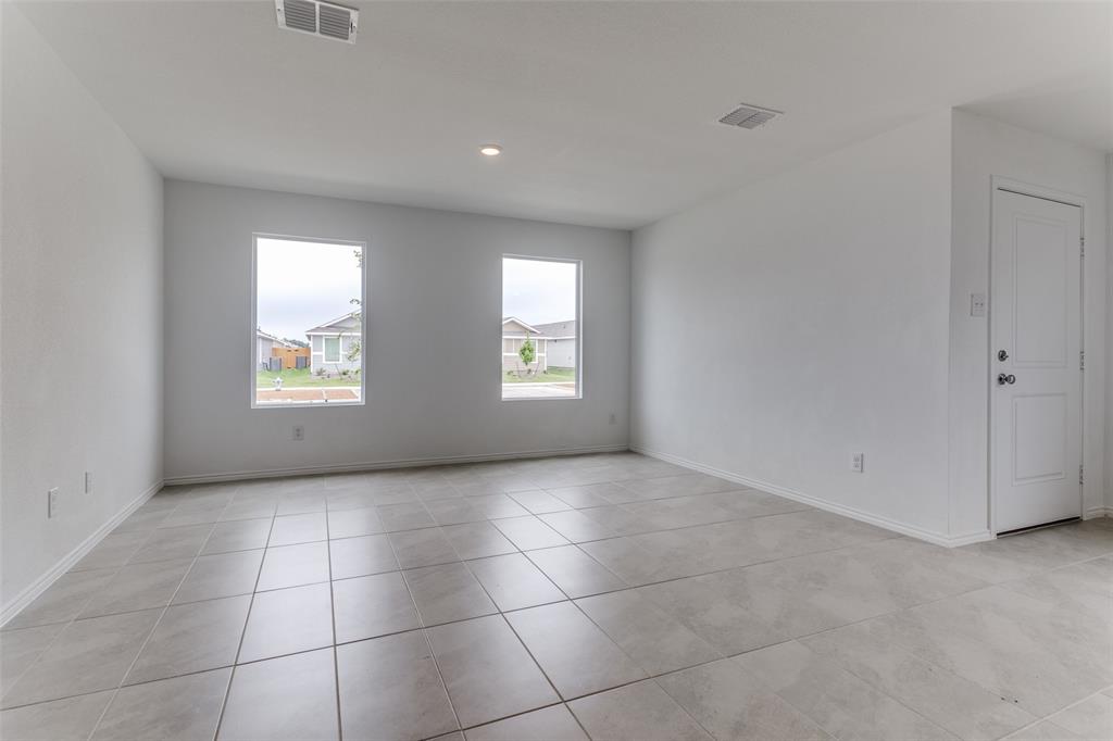 127 Sunflower Street Princeton, TX 75407 - Photo 4 of 21 View of tiled empty room