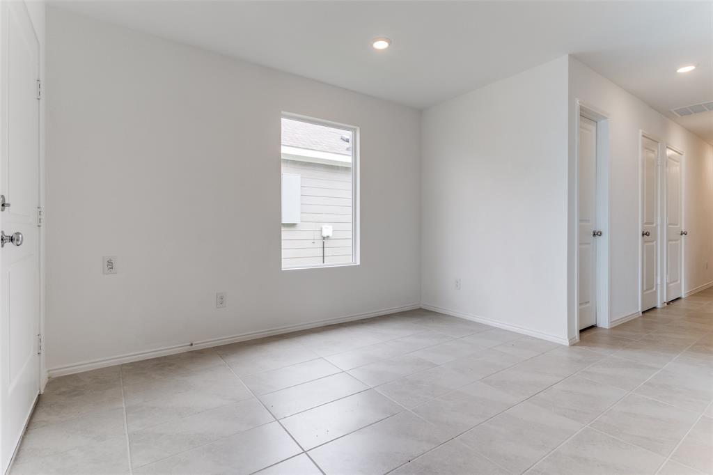 127 Sunflower Street Princeton, TX 75407 - Photo 5 of 21 Empty room with light tile flooring