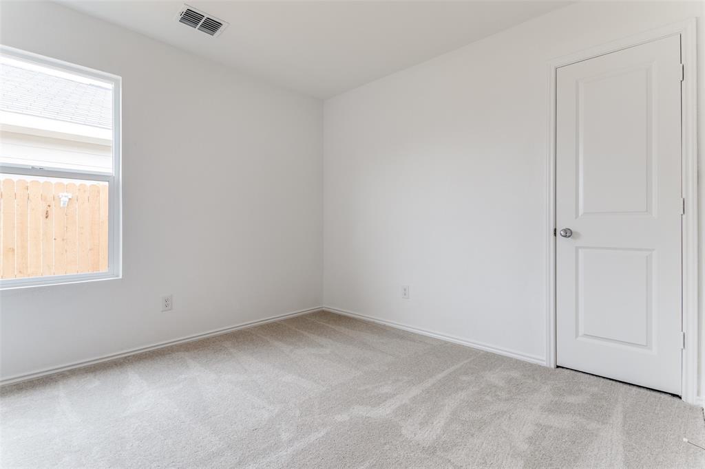 127 Sunflower Street Princeton, TX 75407 - Photo 8 of 21 Carpeted spare room with a wealth of natural light