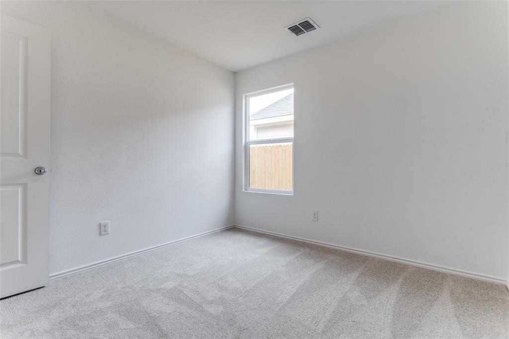 127 Sunflower Street Princeton, TX 75407 - Photo 9 of 21 Empty room with carpet flooring