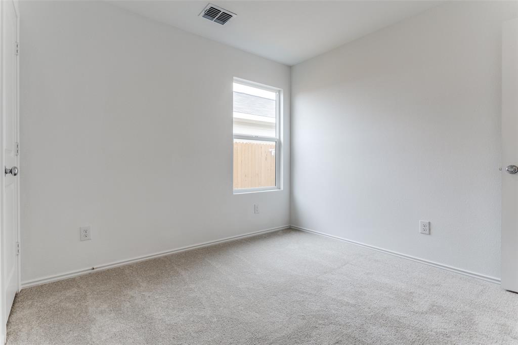 127 Sunflower Street Princeton, TX 75407 - Photo 10 of 21 Carpeted empty room featuring plenty of natural light
