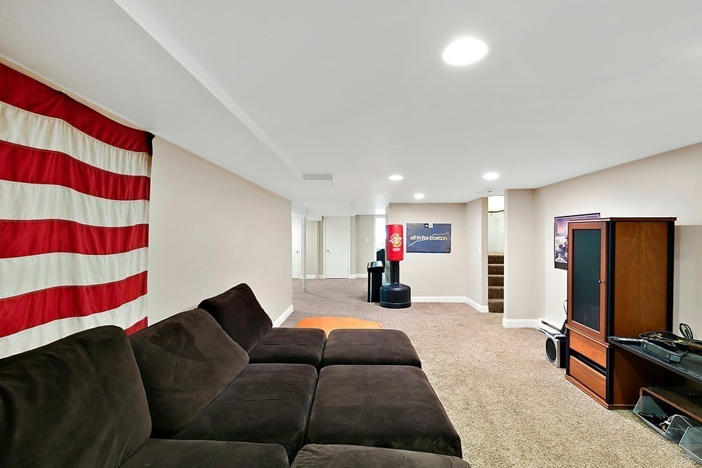 37 Gould Road Newton, MA 02468 - Photo 25 of 29 a living room with furniture and a flat screen tv