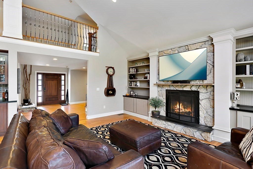 37 Gould Road Newton, MA 02468 - Photo 7 of 29 a living room with furniture a flat screen tv and a fireplace
