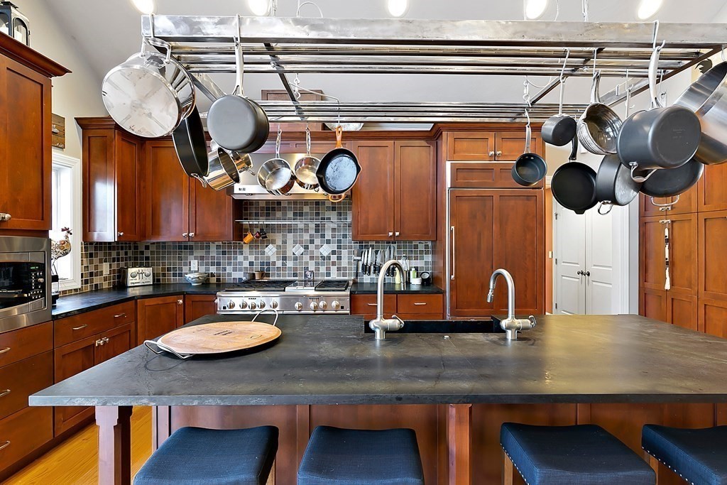 37 Gould Road Newton, MA 02468 - Photo 8 of 29 a kitchen with a table and chairs in it