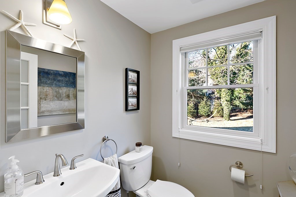 37 Gould Road Newton, MA 02468 - Photo 10 of 29 a bathroom with a toilet sink and mirror