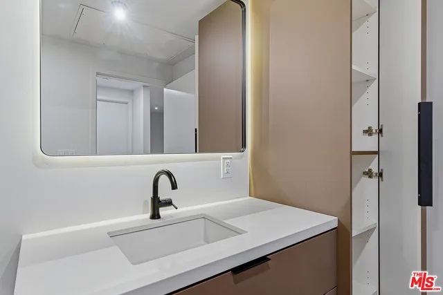 a bathroom with a sink and a mirror