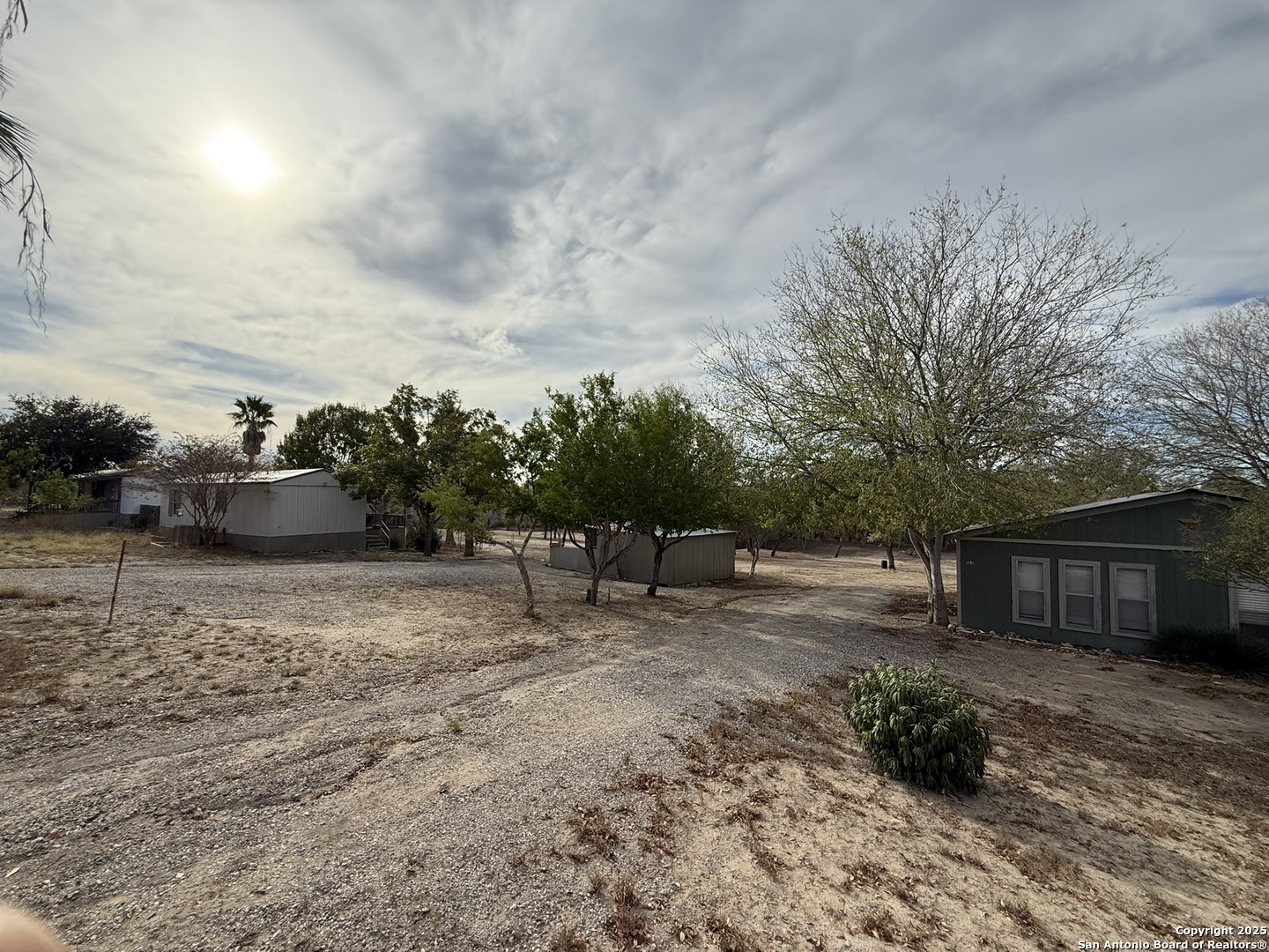 123 Choke Canyon Estates Drive Three Rivers, TX 78071 - Photo 2 of 19 a backyard of a house with table and chairs