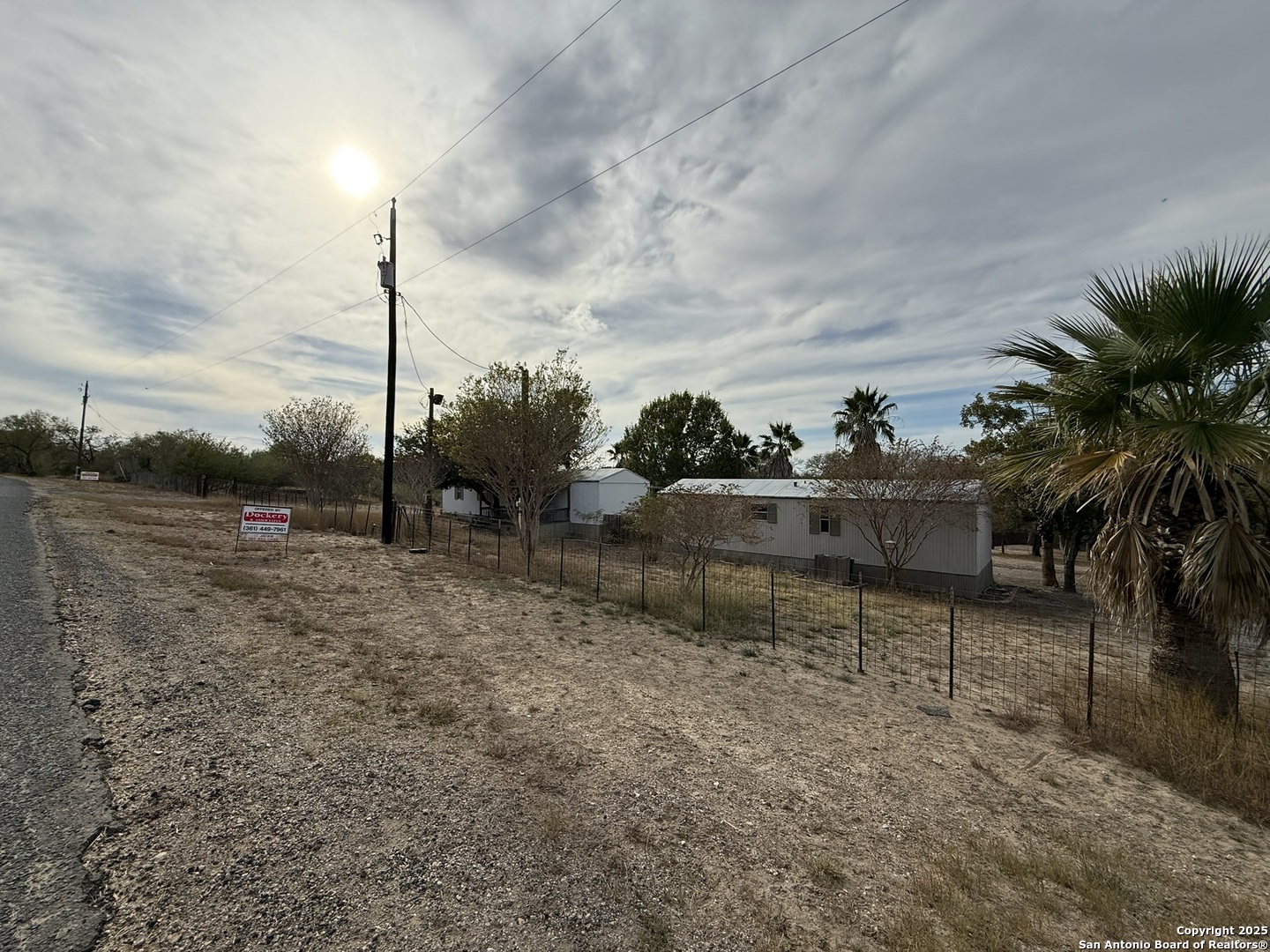 123 Choke Canyon Estates Drive Three Rivers, TX 78071 - Photo 3 of 19 a view of a garden with a fountain
