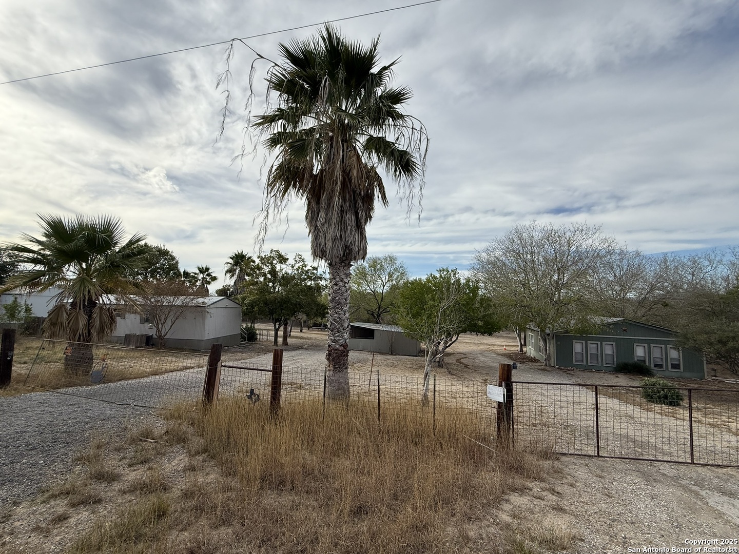 123 Choke Canyon Estates Drive Three Rivers, TX 78071 - Photo 4 of 19 a view of a yard and entertaining space