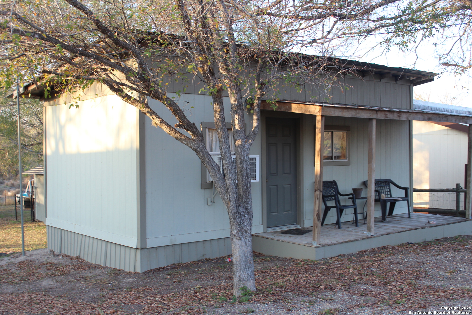 123 Choke Canyon Estates Drive Three Rivers, TX 78071 - Photo 7 of 19 a view of a chairs and table in backyard of the house