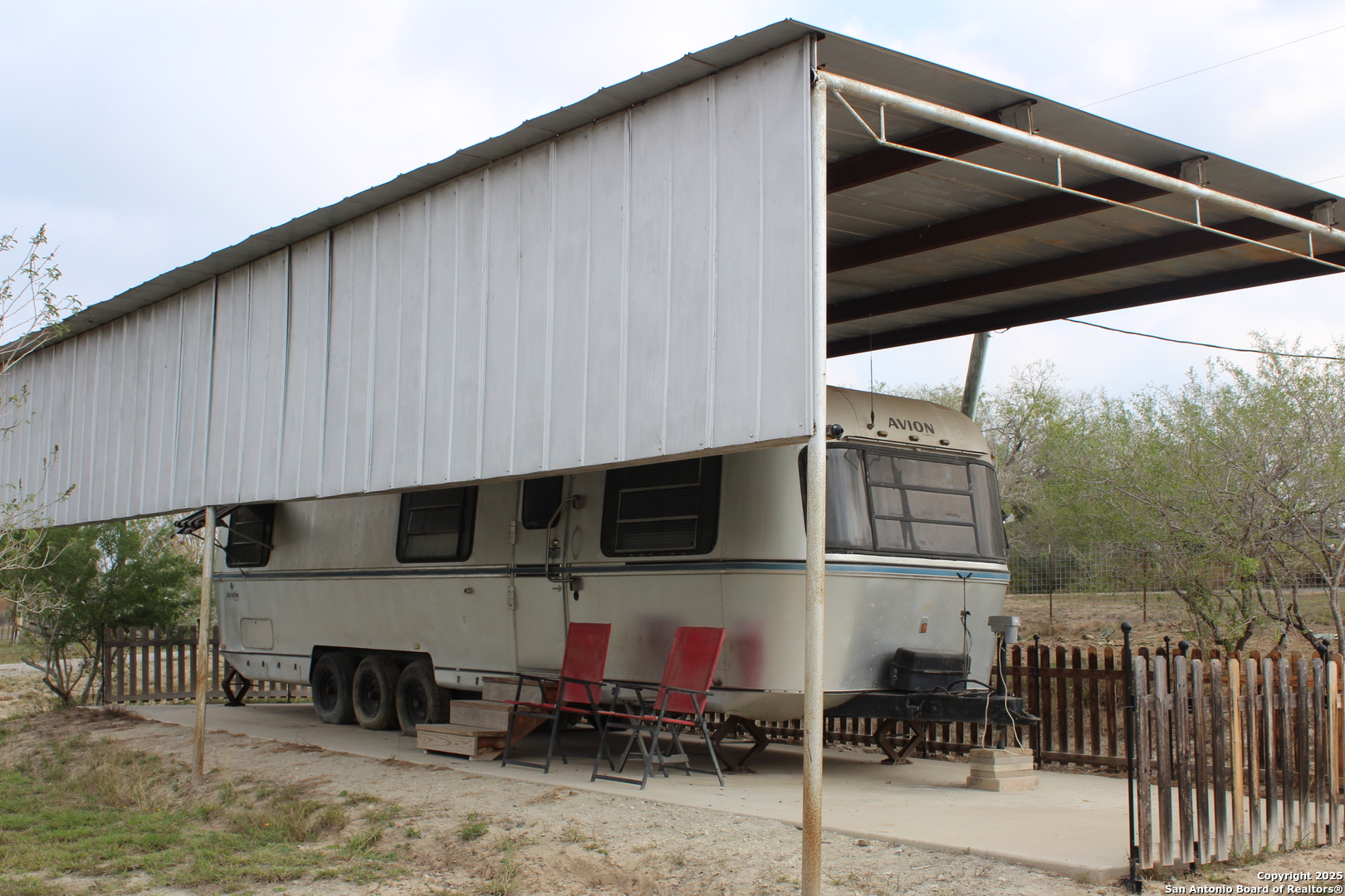 123 Choke Canyon Estates Drive Three Rivers, TX 78071 - Photo 8 of 19 a view of a back yard with patio