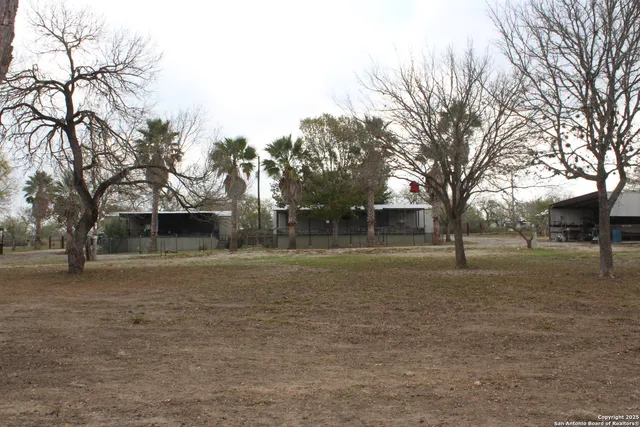 a view of a yard with a house
