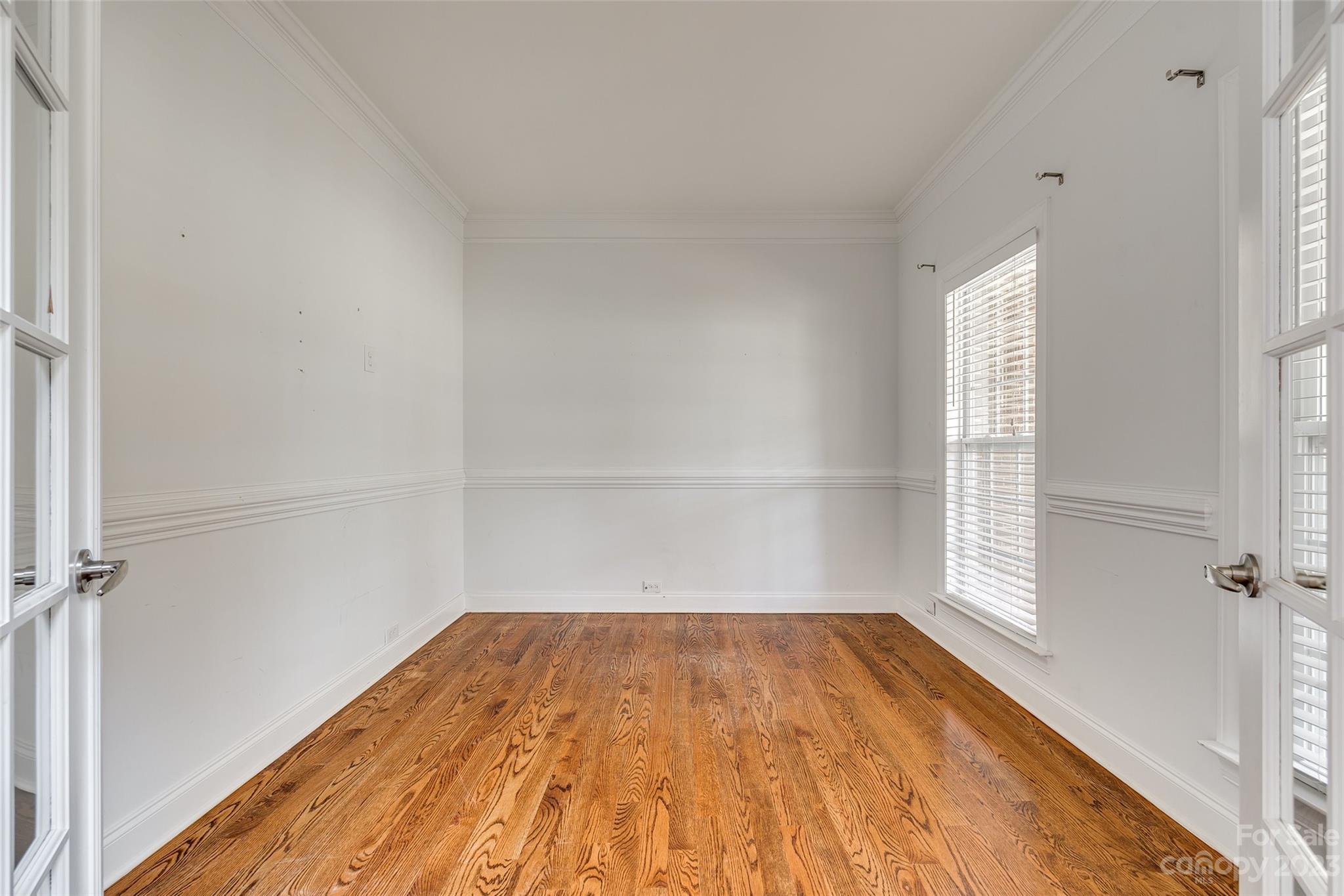 16420 Woolwine Road Charlotte, NC 28278 - Photo 17 of 41 a view of empty room with wooden floor and fan