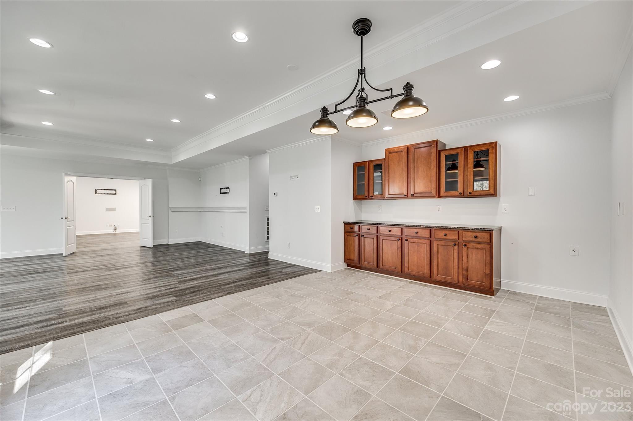 16420 Woolwine Road Charlotte, NC 28278 - Photo 20 of 41 a view of a kitchen with a stove and a ceiling fan