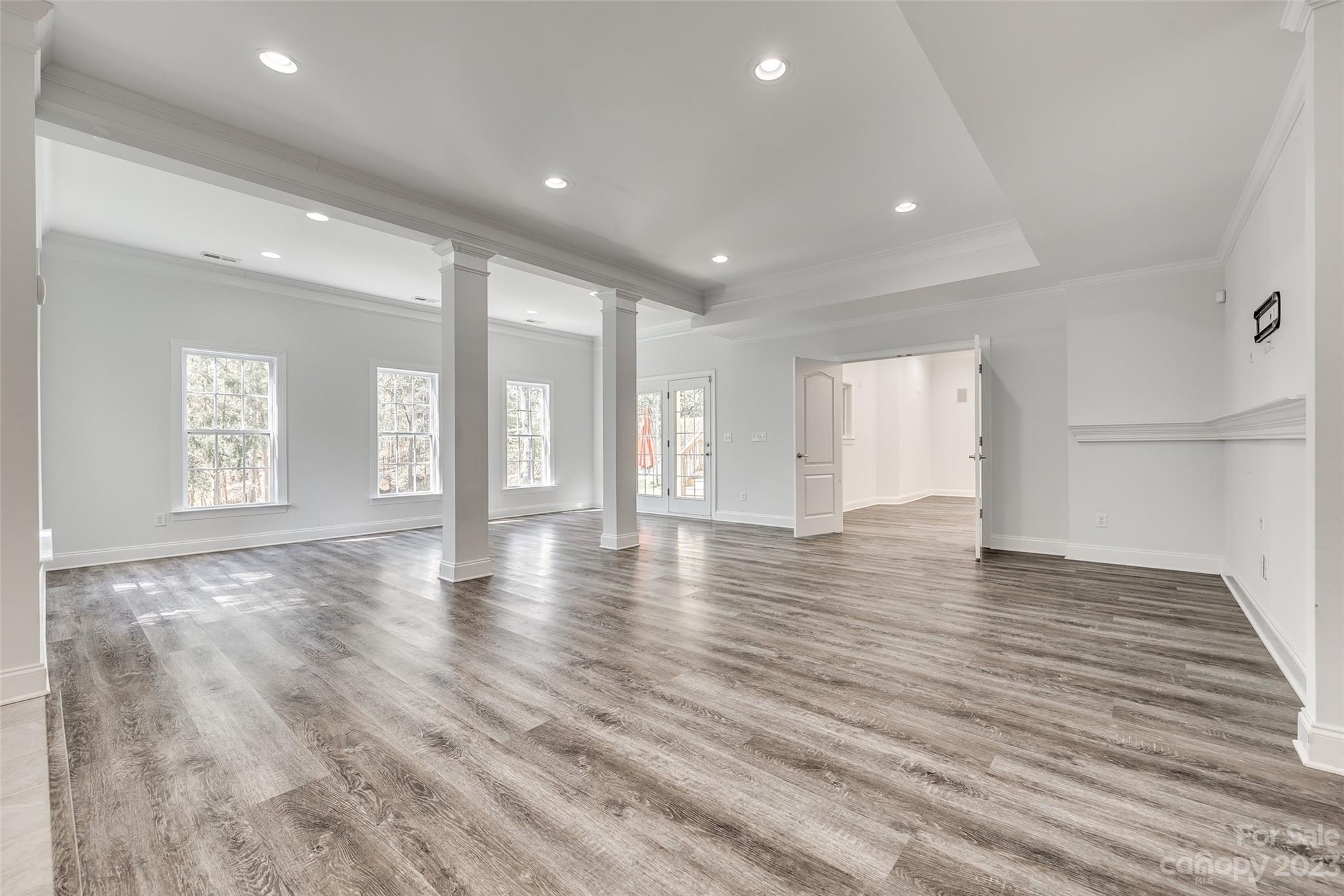 16420 Woolwine Road Charlotte, NC 28278 - Photo 21 of 41 a view of an empty room with wooden floor and a window