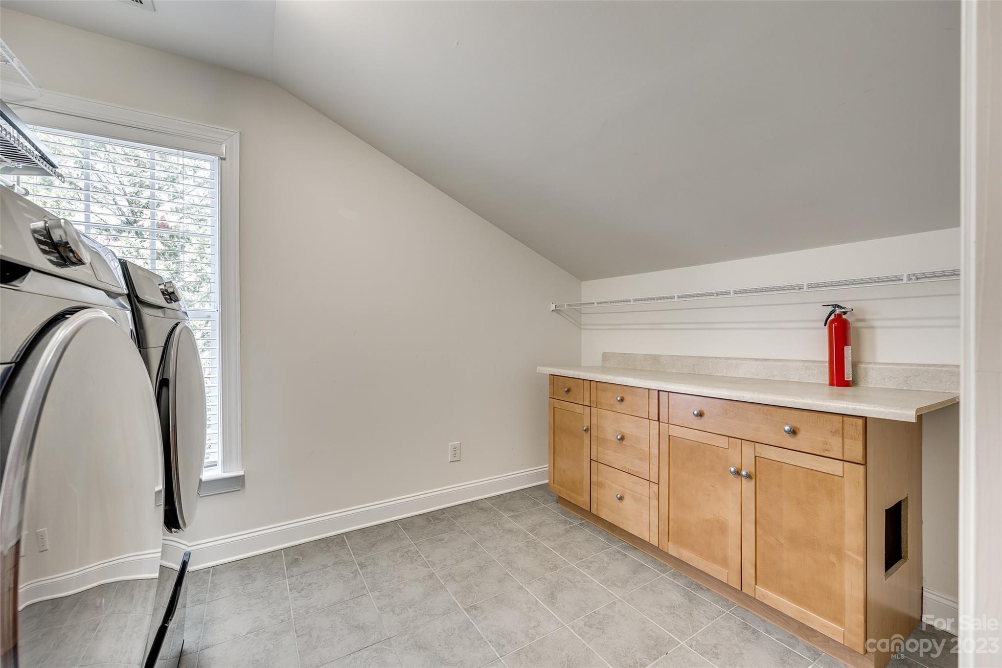 16420 Woolwine Road Charlotte, NC 28278 - Photo 24 of 41 a utility room with cabinets washer and dryer
