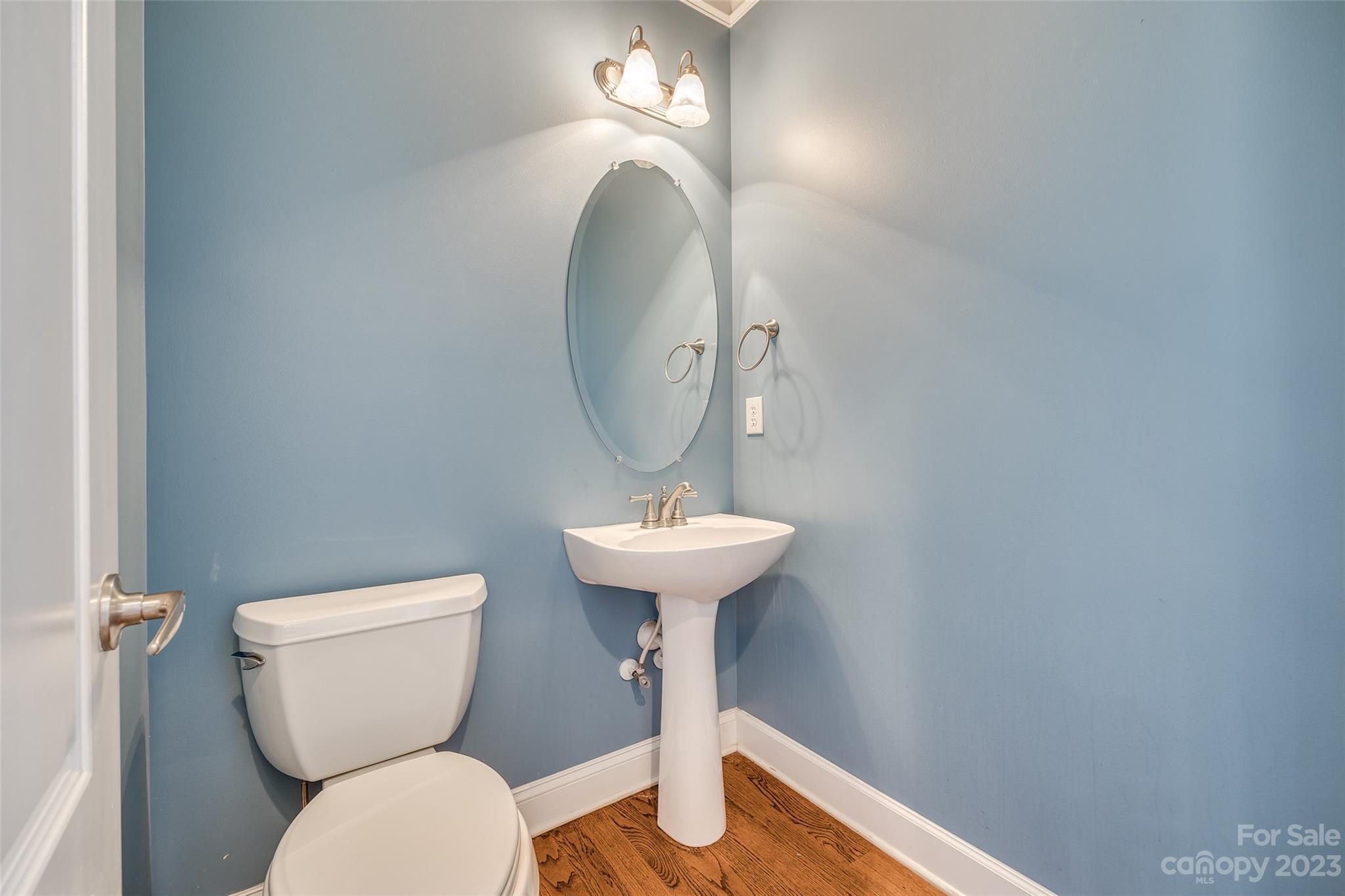 16420 Woolwine Road Charlotte, NC 28278 - Photo 27 of 41 a bathroom with a toilet sink and mirror