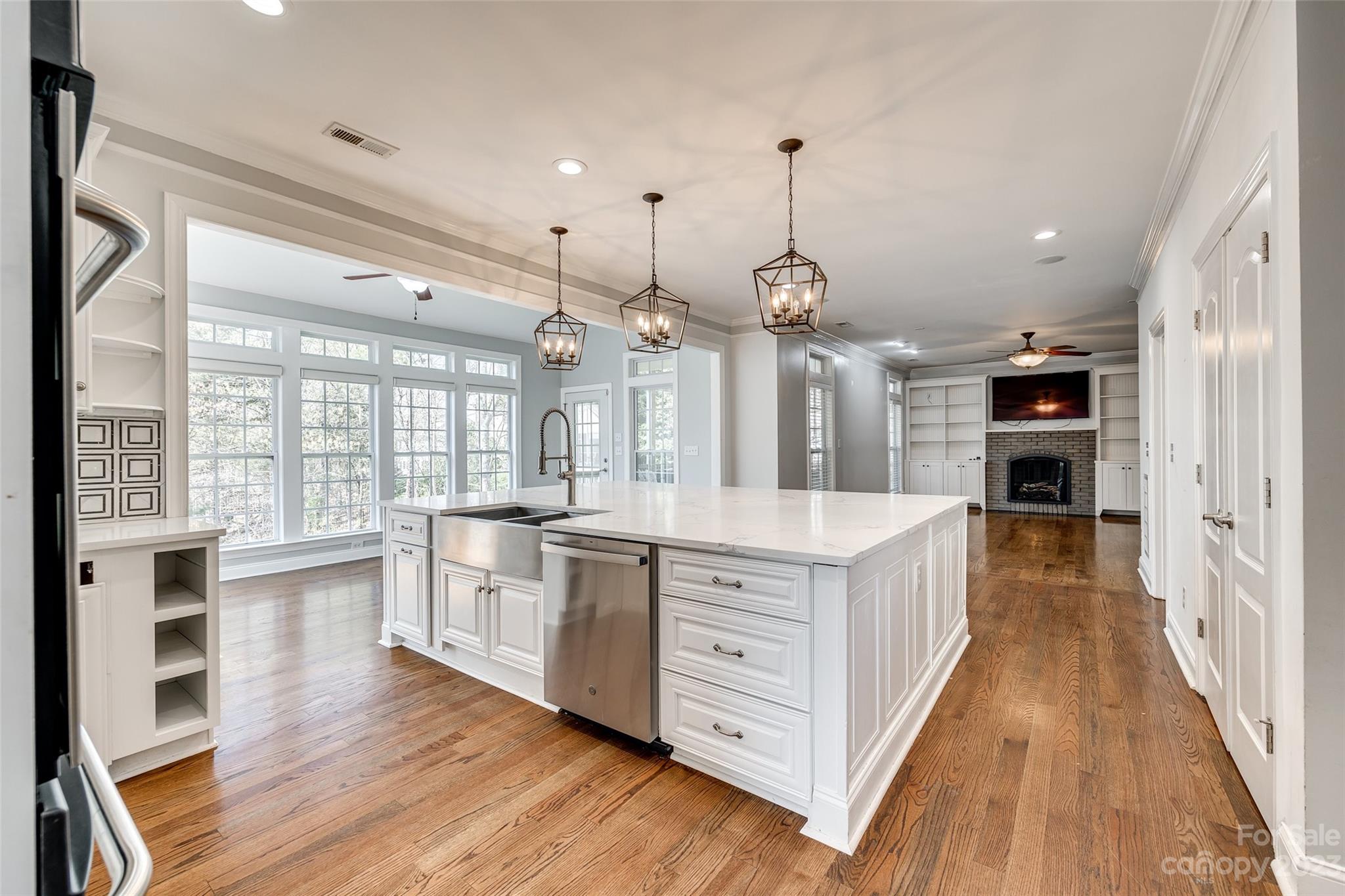 16420 Woolwine Road Charlotte, NC 28278 - Photo 3 of 41 a large kitchen with stainless steel appliances granite countertop a large center island attached withe living room