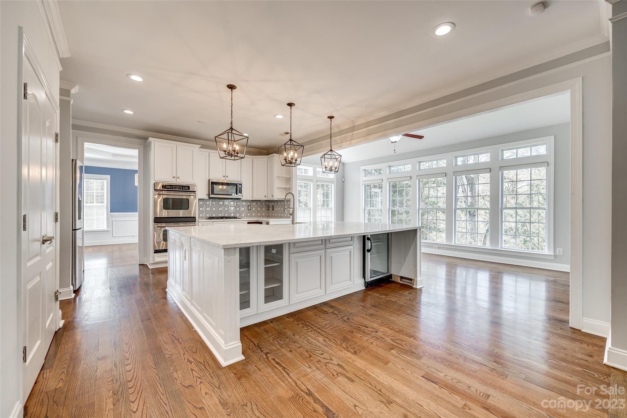 16420 Woolwine Road Charlotte, NC 28278 - Photo 31 of 41 a kitchen with stainless steel appliances sink stove and cabinets